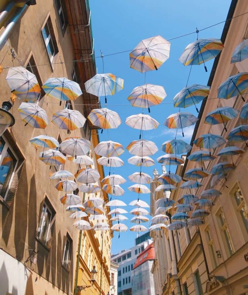 Umbrellas hanging above street Bratislava
